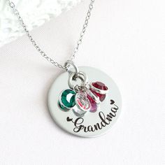 Whether you're looking for a gift for Mother's Day, a birthday, or just because, this necklace is the perfect way to show your grandma how much you care. You can also add birthstones as the family grows! At HeartfeltTokens, our customized jewelry is expertly engraved and made with high-quality stainless steel to ensure a timeless design that won't fade over time. All of our items are 100% designed, engraved, and shipped to you from our home studio in Florida, so I thank you for supporting our sm Customizable Stainless Steel Jewelry For Mother's Day, Round Charm Necklaces For Mom, Round Charm Necklaces As Gift For Mom, Nickel Free Round Charm Necklace For Mom, Nickel-free Round Charm Necklace For Mom, Stainless Steel Round Pendant Jewelry For Mother's Day, Mother's Day Personalized Stainless Steel Jewelry, Mother's Day Stainless Steel Necklace For Mom, Mother's Day Gift Stainless Steel Necklace