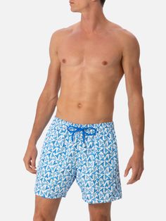 Man Lighting mid-length swim shorts are designed with a lightweight fabric that dries quickly, earning their name Lighting. The elasticized waistband and drawstring closure with branded terminals ensure a comfortable fit, while the branded eyelets are strategically placed to drain water and prevent the shorts from ballooning. Featuring side pockets with French seams and a back patch pocket with a magnetic closure, these swim shorts are both practical and stylish. Additionally, there's a small in Drawstring Swim Trunks For Poolside, Short Length Drawstring Swim Trunks For Poolside, Poolside Swim Trunks With Drawstring, Poolside Short Swim Trunks With Drawstring, Functional Drawstring Shorts For Pool And Beach Season, Short Length Swim Trunks With Drawstring For Vacation, Bermuda Beachwear Swim Trunks With Built-in Shorts, Bermuda Swim Trunks With Built-in Shorts, Beachwear Shorts With Short Inseam For Poolside