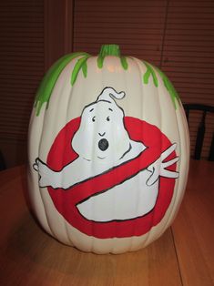 a large white pumpkin with a ghost on it