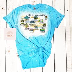 Our National Parks Bella and Canvas shirt is the perfect way to show your love for America's natural wonders! Made with soft, high-quality fabric, this comfortable tee features a bold graphic design that showcases some of the most breathtaking landscapes and wildlife found in our country's many national parks. Whether you're planning a trip to one of the parks or just want to commemorate your love for the great outdoors, this shirt is a must-have addition to your wardrobe. It's available in a ra Cotton Tops For Summer Hiking, Blue Cotton Tops For Summer Adventures, Wilderness Fashion, National Park Clothing, South Dakota Vacation, National Park Shirt, Us Road Trip, Adventure Outfit, National Parks Trip