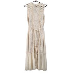 Anthropologie Sleeveless Embroidered Lace Boho Maxi Dress Color Ivory Fabric Shell 100% Polyester Size Xs New With Tags! Excellent Brand New Condition. Purchased Online From Anthropologie And Never Wore. Approximate Measurements (Flat Lay) Bust 17 1/2” Hips 20” Length 51” Gorgeous Mixed Lace Dress Has A Slim Maxi Silhouette. The Lace And Embroidery Detail Is So Beautiful And Feminine With Its Ruffle Hem Complimenting It Perfectly. Includes A Removable Fabric Belt And Extra Button For Its Back Ke Fitted Off White Sleeveless Maxi Dress, Sleeveless Embroidered Dresses For Daywear, Embroidered Sleeveless Dress For Daywear, White Sleeveless Lace Maxi Dress, Sleeveless Embroidered Beige Dress, White Sleeveless Maxi Dress With Floral Embroidery, Embroidered Lace Sleeveless Maxi Dress, Sleeveless Lace Maxi Dress With Floral Embroidery, Sleeveless Embroidered Lace Maxi Dress