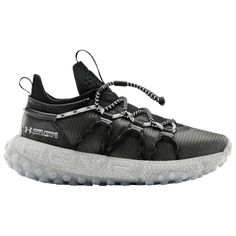 a black and white sneaker with laces on the side, in front of a white background