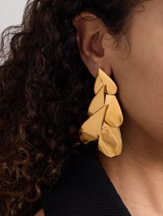 Alaïa's 'Nested' earrings are designed to look like hearts spliced and layered on top of each other. They're cast from gold-tone metal and have a surprisingly lightweight feel. Statement Gold Earrings, Summer Style Guide, Flat Dress Shoes, Designer Pieces, Floral Dresses Short, Gucci Eyewear, Room Fragrances, Exclusive Dress, Gold Statement Earrings