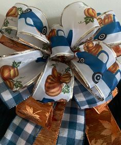 a blue and white bow with apples on it