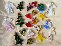 christmas ornaments are arranged on a white sheet