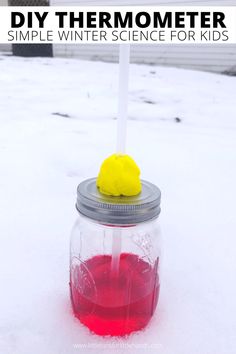 a jar filled with red liquid sitting in the snow next to a sign that says diy thermometerer simple winter science for kids