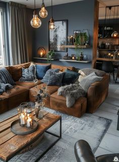 a living room filled with lots of furniture next to a large glass window and a wooden coffee table