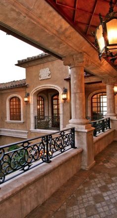 an outdoor patio area with wrought iron railing