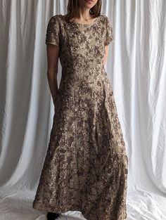 Catch everyone's eye in this stunning sequined floral lace maxi dress!  - Elegant handmade rose embroidery adds shimmering accents  - Flattering crew neck and plunge back highlight your silhouette - Short sleeves and ankle-grazing length keep you comfortable - Inner lining and back zip closure ensure a perfect, secure fit This exquisite lace fabric dress makes a jaw-dropping statement for any special occasion. The intricate floral sequin details give a touch of luxury while the classic maxi silh Party Embroidered Lace Maxi Dress, Embroidered Lace Dress For Evening, Fitted Embroidered Maxi Dress For Prom, Lace Mother Of The Bride Dress With Sequins, Festive Fitted Lace Mother Of The Bride Dress, Fitted Floral Embroidery Maxi Dress For Festive, Fitted Floral Embroidered Maxi Dress For Festive Occasions, Fitted Floral Embroidered Festive Maxi Dress, Fitted Festive Maxi Dress With Floral Embroidery