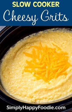 slow cooker cheesy grits in a crock pot with cheese on top