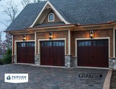 two garages are shown with lights on the top and one is dark brown in color