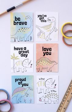 four dinosaur cards with the words be brave, have a great day and love you