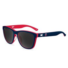 Stay shaded in Minnesota Twins style with these Premiums Sport sunglasses. They feature polarized UV400 lenses to keep sun rays at bay and rubberized non-slip nose pads to keep them comfortably in place. The distinct Minnesota Twins graphics make these the perfect finishing touch to any fan look.Stay shaded in Minnesota Twins style with these Premiums Sport sunglasses. They feature polarized UV400 lenses to keep sun rays at bay and rubberized non-slip nose pads to keep them comfortably in place. Sporty Wayfarer Sunglasses With Uv Protection, Sporty Wayfarer Sunglasses With Mirrored Lenses, Sporty Polarized Wayfarer Sunglasses, Sports Sunglasses With Gradient Wayfarer Lenses, Sports Wayfarer Sunglasses With Uv Protection, Sports Wayfarer Sunglasses With Gradient Lenses, Sports Sunglasses With Gradient Lenses And Wayfarer Shape, Sports Sunglasses With Tinted Adjustable Lenses, Sports Polarized Wayfarer Sunglasses