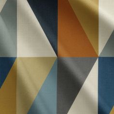 a multicolored fabric with an abstract design in blue, orange and yellow colors