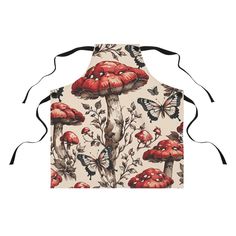 an apron with red mushrooms and butterflies on it