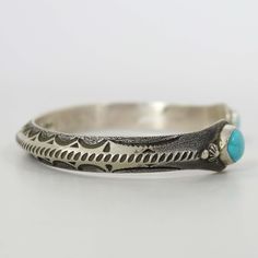 Sterling Silver Cuff Bracelet with Hand-Stamped Designs and set with Natural Turquoise on the Cuff Terminals. .25” Cuff Width6” Inside Measurement, plus 1.25” opening(7.25" Total Circumference - Large) Wire Cuff, Zuni Jewelry, Concho Belt, Navajo Jewelry, Native Jewelry, Southwestern Jewelry, Turquoise Cuff, Sterling Silver Cuff Bracelet, Kingman Turquoise