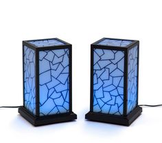 two lamps that have been made to look like cracked tiles on the side of each lamp