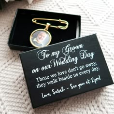 a black box with a gold tie clip and a card saying to my groom on our wedding day