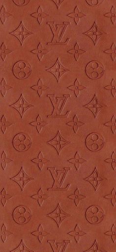 an image of a leather background with the letters louis vuitton written in cursive writing