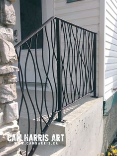 an iron railing on the side of a house