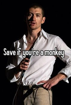 a man standing in front of a microphone with the words save if you're a monkey