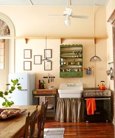 a kitchen with an oven, sink and refrigerator