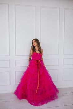 This hot pink princess dress will make you feel like you stepped straight out of a fairy tale. With its floor length and voluminous design,  it's perfect for any romantic occasion, from weddings to proms.  The small velvet belt and bow ties add unique and beautiful touches,  making you look and feel majestic.  (No awkward pumpkin coach rides here.) Message me for any kind of customizations. Pink Ball Gown Princess Dress For Debutante Ball, Pink Ball Gown For Debutante Ball, Pink Tulle Dresses For Prom Season, Princess Quinceanera Ball Gown With Ruffles, Elegant Pink Princess Dress For Debutante Ball, Princess Style Ball Gown For Prom, Pink Princess Dress For Debutante Ball, Pink Fitted Princess Dress For Quinceanera, Princess Style Quinceanera Dress With Ruffles For Party