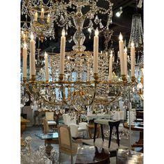 a large chandelier with many candles hanging from it's centerpieces