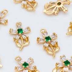 High quality CZ flower charms, 18K real gold plated over brass, color not easily tarnish, lead nickel free Size: 13x8mm, hole size 1mm approx. (see Pic 2) Quantity: 10pcs Color: gold Material: real gold plated brass, cubic zirconia ❤ More gold plated brass items here: ❤ https://www.etsy.com/shop/Nbeads?search_query=GB ❤ More metal findings(brass, silver, alloy etc.) here: ❤ https://www.etsy.com/shop/Nbeads?section_id=6656259 Gold Flower-shaped May Birthstone Jewelry, Gold Flower Jewelry For May Birthstone, Gold Jewelry With Flower Charm For May Birthstone, Gold Flower Charm Pendant, Gold Pendant Charm With Flower Detail, Gold Pendant Flower Charm, Gold Flower Charm For Jewelry Making, Gold Pineapple, Gold Feathers