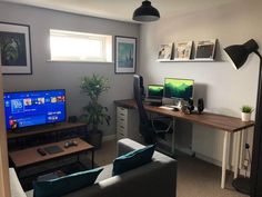 a living room filled with furniture and a flat screen tv sitting on top of a wooden table