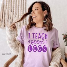 Listing: (1) I Teach Good Eggs Shirt  This fun and unique spring design is perfect for teachers to celebrate the Easter holiday.  Main Listing Photo:  Lilac shirt with purple lettering.  Following Listing Photos:  Pink, Mint and White Shirts, all featuring pink lettering. Black and Deep Heather Gray Shirts, featuring white lettering.  See more Easter themed items here... https://www.etsy.com/shop/tcctn?section_id=23012929 Branding:  Adult: Bella Canvas/Next Level  *All sizing is unisex fit.  *Si Easter Class Party, Lilac Shirt, Old Outfits, Easter T Shirts, Holiday Break, Easter Holiday, Birthday Girl Shirt, Spring Holidays, Spring Design