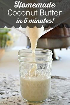 homemade coconut butter is being poured into a mason jar with the words homemade coconut butter in 5 minutes