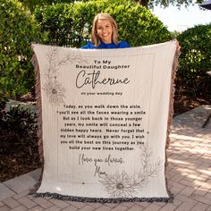 a woman is holding up a quilt that says to her daughter, catherne