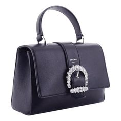 This Cheri bag from Jimmy Choo is crafted from dark blue calfskin leather and features a decorative crystal buckle. The double-snap flap opens to an interior divided by a slip pocket, and includes one zip pocket. This versatile handbag can be carried with the top handle or as a crossbody with the detachable shoulder strap. Look effortlessly polished with this elegant piece from Jimmy Choo.    Model: OSQM | 028  Dark Blue Leather  Silver-tone hardware  Crystal buckle  Double snap closure    Inter Elegant Shoulder Bag With Buckle Closure And Top Handle, Elegant Top Handle Shoulder Bag With Buckle Closure, Designer Leather Bags With Buckle Closure, Formal Top Handle Shoulder Bag With Buckle Closure, Luxury Office Bags With Buckle Closure, Elegant Leather Flap Bag With Turn-lock Closure, Luxury Evening Shoulder Bag With Buckle Closure, Designer Bags With Buckle Closure, Designer Office Bag With Buckle Closure