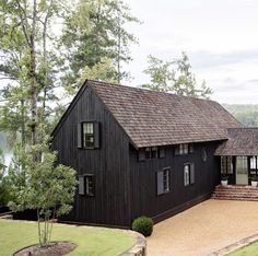 an image of a black house in the woods