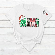 Personalized Christmas Gift Mimi And Kids CTH01 T-ShirtGreat as Birthday gifts or Holiday presents. This adorable item can be designed upon anyone's wish with any title. Please enter: 1. Nickname. ie. Grandma, Nana, Mimi, ...etc. 2. Kids' Names wanted on the shirt (Names separated by commas) All items are made to order. * Please be aware that the physical product's colors may differ slightly from the mockup. Brand: Gildan Classic unisex cut makes this easy to fit the body. Material: Heavyweight Cute Matching Shirts, Matching Shirts For Couples, Holiday T Shirts, Christmas Photo Booth Backdrop, Shirts For Couples, T Shirts Cute, Cowboy Birthday Party, Custom Made Dress, Christmas Photo Booth