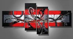 an abstract painting with red and black colors on the wall in front of a gray background