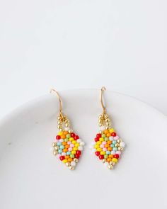 Add a little fun to your jewelry box! The Beaded Confetti Earrings are hand strung by Vi Bella Artisans in Haiti. Colors will vary. Choose from two sizes. Details: Handbeaded by Vi Bella Artisans in Haiti Small - 1 1/4" drop. Large - 1 5/8" drop. Multi-color pattern will vary. Confetti Earrings, Beaded Earrings Patterns, Earring Patterns, Hand Beading, Haiti, Beaded Earrings, Color Patterns, Confetti, Jewelry Box