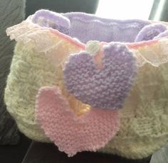 a crocheted purse with a heart on it