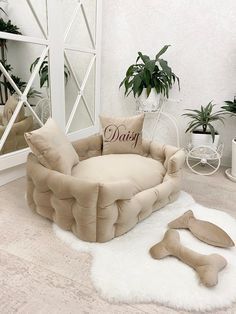 a living room filled with lots of furniture next to potted plants and mirrors on the wall