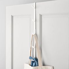 a tote bag hanging on the side of a door