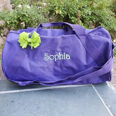 "This personalized gym bag measures 18\" x 10\" x 10\" and it's made with recycled materials! It also has an outside zippered pocket, and easy-to-carry 7\" handles, and an adjustable/removable shoulder strap. Add her name or her team name and it makes a great cheer or monogrammed dance team bag! This girls' duffle bag is available in several colors: navy, red, purple, hot pink, royal, burgundy (2), gray, orange, charcoal, hunter, and black. Monogramming is included in the price!" Duffle Bag Sports, Cheer Bag, Dance Sports, Team Bags, Cheer Team, Dance Bag, Dance Teams, Duffel Bags, Travel Duffel