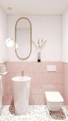 a white toilet sitting next to a sink in a pink tiled bathroom under a mirror