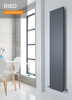 an image of a modern radiator in the living room with white chairs and table