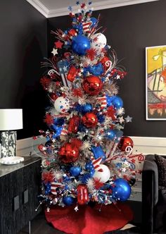 a christmas tree decorated with red, white and blue ornaments