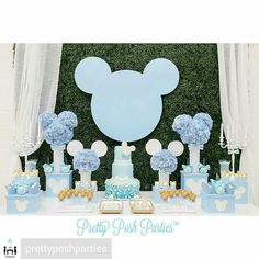 a mickey mouse party with blue and white decorations