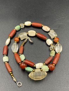 The origin of this beads from the central Asian country Afghanistan. The history of this beads is more than 2000 years old . many kingdoms passes through this countries of central Asian for example Greek roman Sasanian many others. they were used to be a jewelry ornaments and trade beads in ancient times . the necklace got white crystals and red agate and green color turquoise and got two Special small size white crystal tortoise and in the central one amulet type white crystal amulet bead we pr Crystal Amulet, Jewelry Ornaments, Carnelian Beads, Unusual Jewelry, White Crystals, Color Turquoise, Quartz Beads, Trade Beads, Red Agate