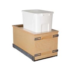 a white container sitting on top of a wooden box with metal handles and two drawers