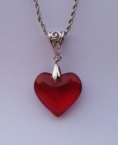 Small Red Glass Heart Silver Charm Necklace  ❤ Sweet Red Glass Heart measures      25mm X 20mm and uses an      ornate filagree silver bail. Strung on a silver-plated stainless steel ROPE CHAIN with lobster clasp of custom length: CHOOSE YOUR CHAIN LENGTH FROM OUR PULL-DOWN MENU: ❤ 45cm /17.7 inches OR ❤  50cm / 19.7 inches OR ❤ 55cm / 21.6 inches OR ❤ 60cm / 23.6 inches SPEEDY SHIPPING: ❤ Ships same day as ordered to USA. ❤ NO RETURNS ACCEPTED ON THIS ITEM. Live the HEARTFELT Life! Valentine's Day Red Heart Necklace, Red Heart Charm Necklace For Gift, Red Heart Necklace For Gift, Red Heart Necklace For Gifts, Red Heart Cut Necklace For Mother's Day, Red Heart Necklace For Valentine's Day Gift, Red Sterling Silver Heart Charm Necklace, Red Heart Pendant Necklace In Sterling Silver, Red Sterling Silver Heart Pendant Necklace