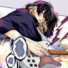 a man with long black hair playing an electric guitar